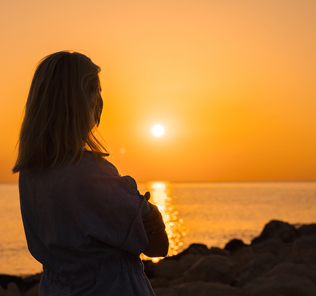 women looking at sunset