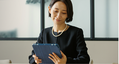 a woman looking at an iPad