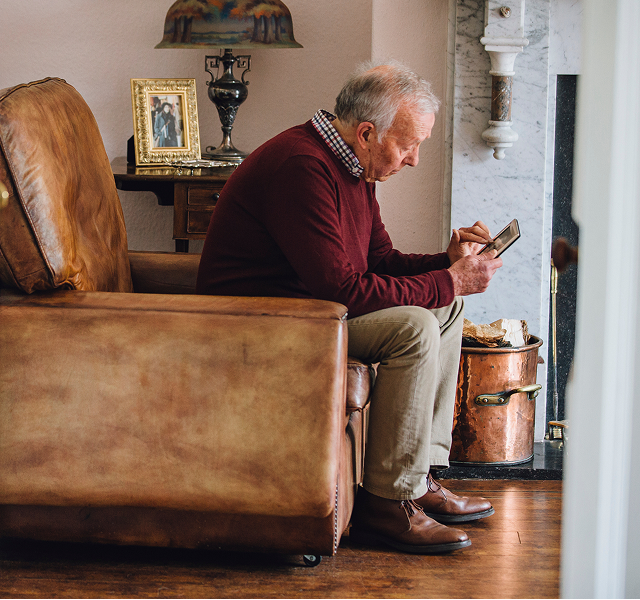 man looking at a photo