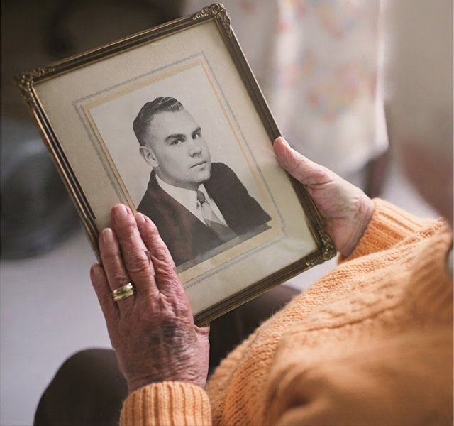 a woman looking at a photo
