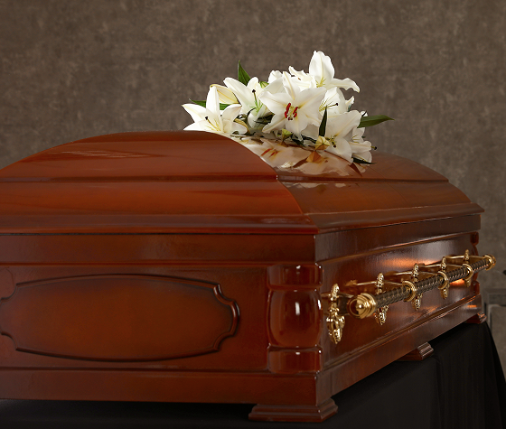 coffin with flower arrangement