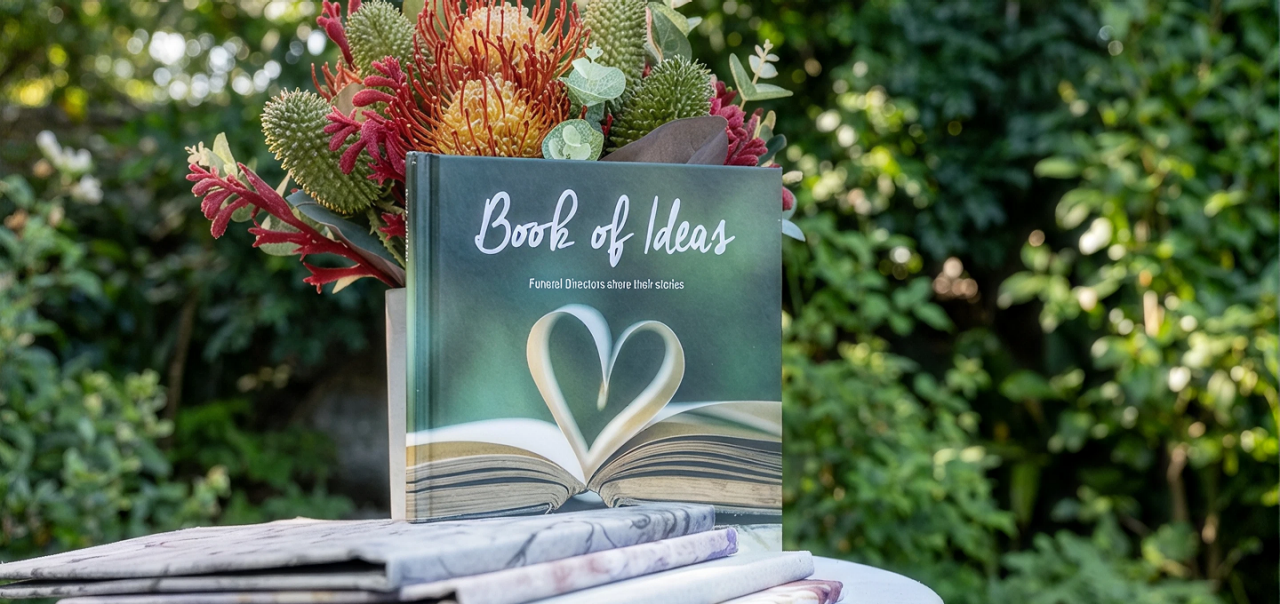 An image of an open book which has the middle pages arranged in a shape of a heart